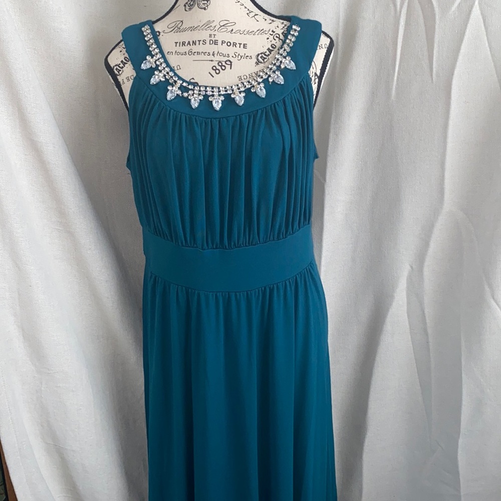 Sandiva XL floor length dress with embellished neck line. emerald green color